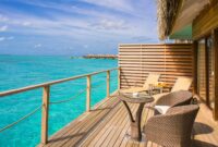 Peaceful overwater bungalow with ocean view, perfect for a tropical getaway.