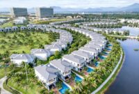 Stunning aerial image showcasing luxury villas with private pools at a resort in Vietnam.