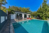 Experience serenity at a stylish villa with a private outdoor swimming pool.