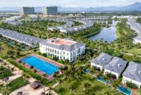 A stunning aerial shot of a luxurious tropical resort with villas and a pool in Vietnam.