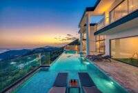 Royal Garden Villas Private Luxury Villas With Garden Views Stunning luxury villa overlooking the ocean with an infinity pool at sunset.